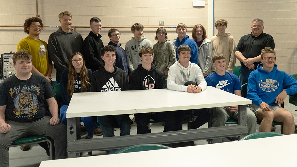 Students celebrate the 100th graduate of the Batavia Career & Technical Education Center's Mechatronics Program